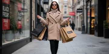 Woman with shopping bags during Black Friday sales
